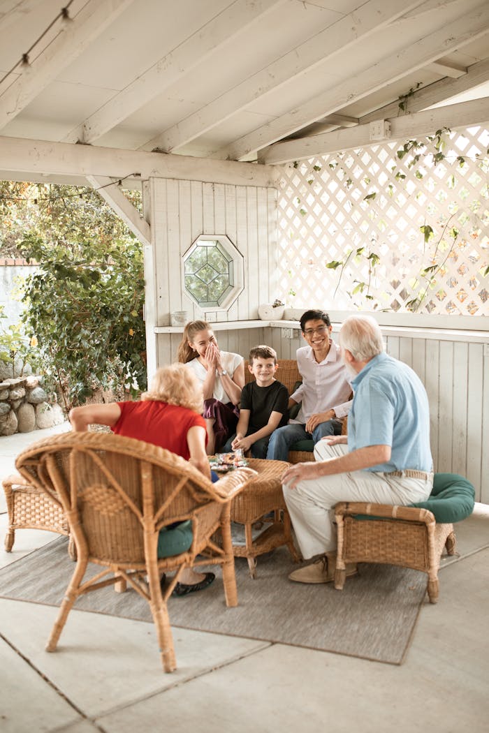 services-01 A multi-generational family spending quality time together on a cozy patio setting.